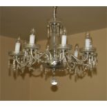 An 8 branch glass Chandelier, with centre vase shaped stem, the arms united by festoon of