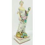An early 19th Century Staffordshire pearl ware Figure of "Pamora" c. 1820 modelled standing in