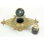 A brass Inkstand, with classical masks and shell handles and hinged cover; and another smaller brass