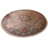 An extremely attractive and profusely decorated large circular Rug or Carpet, the entire ground with