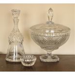 A large cutglass Bowl & Cover, with prism finial, 26cms (10") and a thistle shaped cutglass Decanter