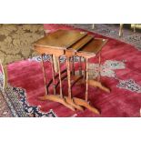 A nest of three rectangular mahogany Occasional Tables, on turned supports, 19" (49cms) the largest.