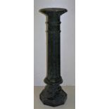 A 19th Century carved green marble pillar Pedestal, with circular top over a reeded column, on an