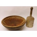A large wooden Bowl, 15" (39cms), and a turned Wooden Pounder, 13 1/2" (34cms). (2)