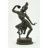 An early bronze Figure, possibly "Vajrapani," Tibet, depicted in dancing mode, with decorative