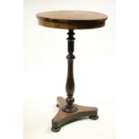 A small Irish Victorian rosewood and mahogany circular Occasional Table, on turned baluster stem,