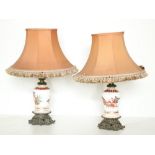 A pair of milk glass and ormolu mounted Table Lamps, decorated with Roman scene, each with peach