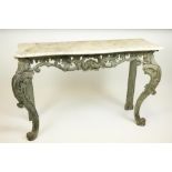 A carved, pierced and painted Side Table, in the rococo style, early 19th Century, with serpentine