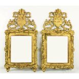 A pair of late 18th Century Continental flat carved gilt Pier Mirrors, each crested with a carved