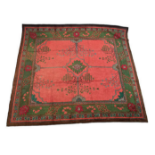 A very attractive antique Turkish type Carpet, the rose red ground with geometrical designs in