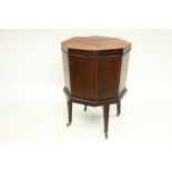An Irish 19th Century inlaid mahogany octagonal shaped Wine Cooler, with lift top and lead lined