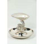 An attractive silver scallop Dish, modelled as a half shell supported on a conforming dolphin with a