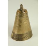 A 19th Century Middle Eastern brass double gong 'camel' Bell, the base decorated with Arabic text,