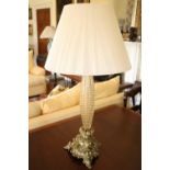 An attractive shaped, reeded and bubble glass Table Lamp & Shade, on a heavy triform brass base,