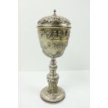 A fine quality Irish Victorian silver Standing Cup and Cover, decorated in repoussé design with