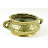 A heavy 19th Century Chinese gilded bronze two handled Censor, the floral rimmed top over a