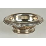 An Edwardian silver Bowl, the shaped and decorated rim designed with shell and beading, on a stepped