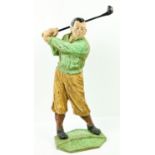 An interesting cast iron and painted Door Stop, modelled as a Golfer swinging a club, approx.