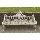 An important heavy pair of Victorian cast iron Garden Benches, each pierced back with a roundel