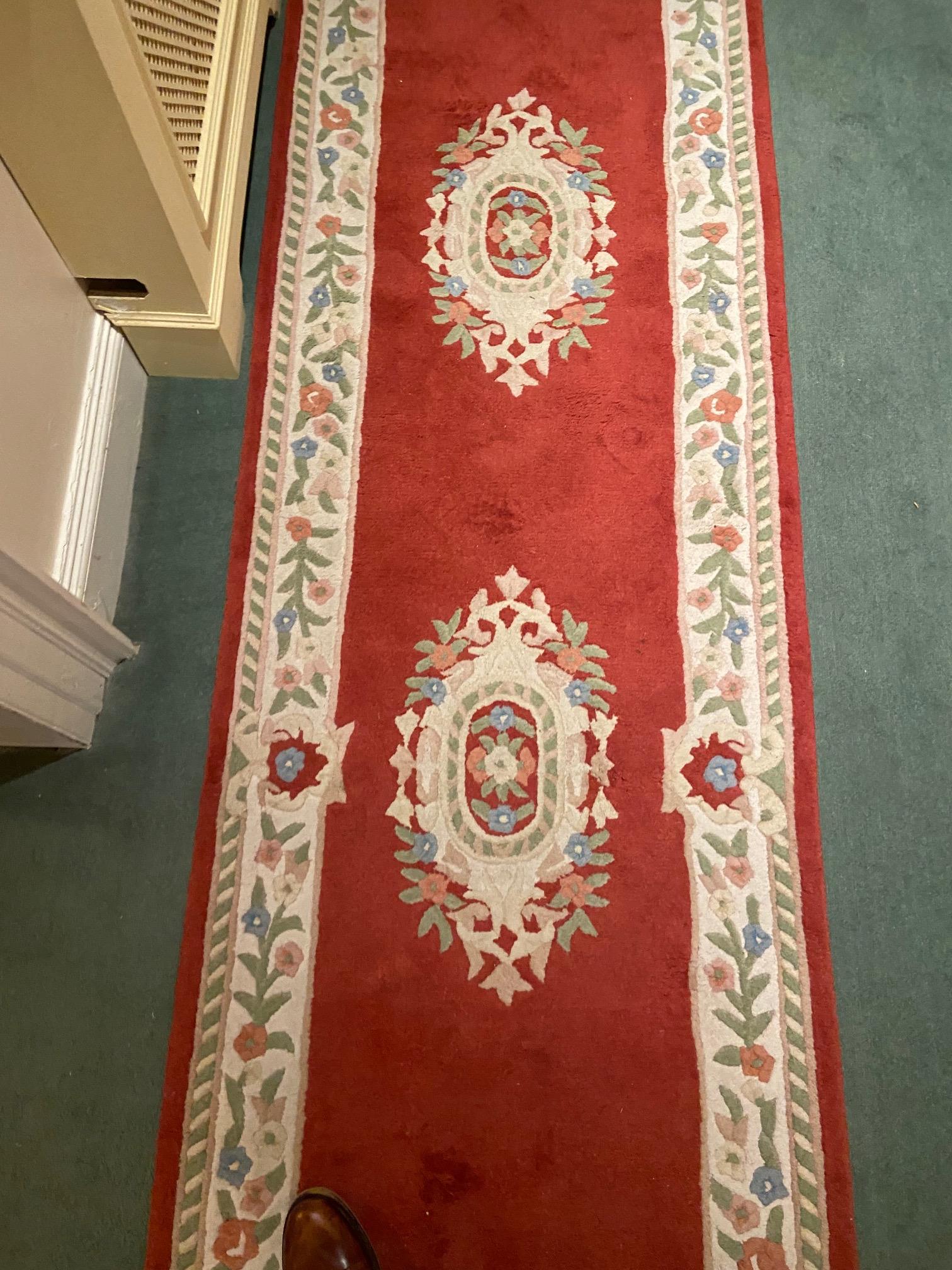 A set of three red/pink ground woollen Runners, each with a cream ground floral border and three - Image 5 of 8