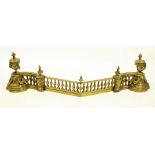 A very attractive and unusual brass Fender, with balustrade, lion masks, leaf swags and an