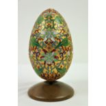 A fine quality Chinese cloisonné designed Egg, with gilded ground and intricate foliage