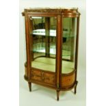 An attractive French satinwood gilt brass mounted and parquetry inlaid Vitrine of breakfront