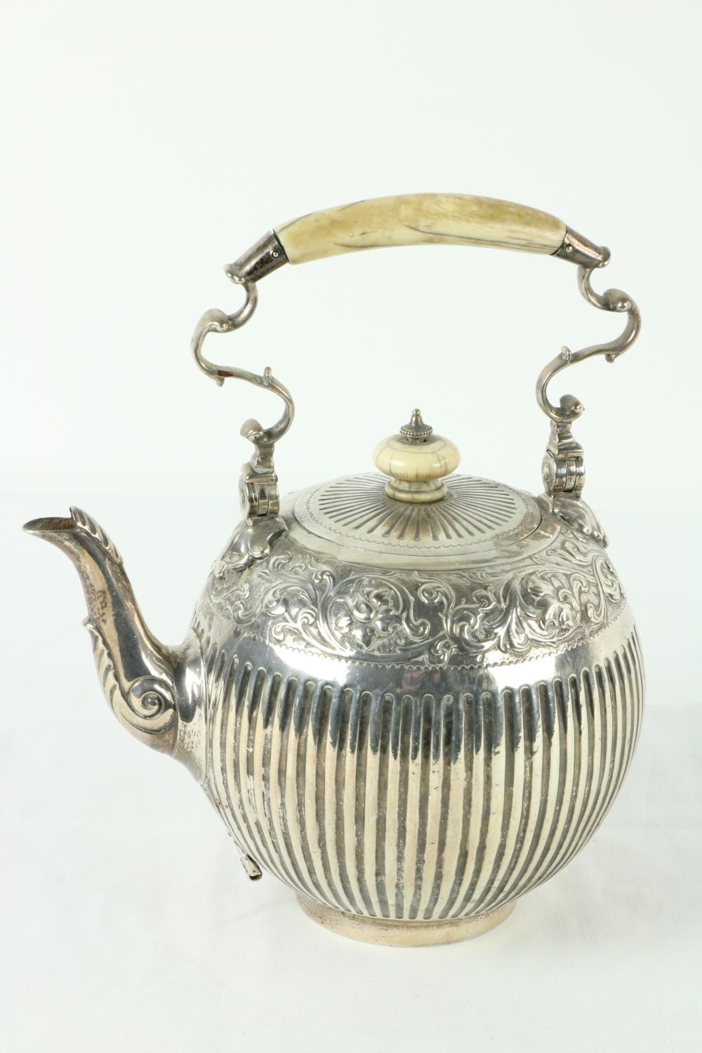 A Victorian silver half fluted Tea Kettle, of bulbous form with ivory handle and finial chased