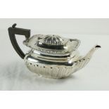 A rectangular half reeded silver Teapot, with ebonised handle, Birmingham 1913, 572 grams. (1)
