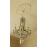 A fine Regency gilt bronze Chandelier, the inverted cutglass bowl corona issuing festoons of glass
