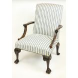 An attractive George II style Library Armchair, with padded back and seat, the arm rests with fish