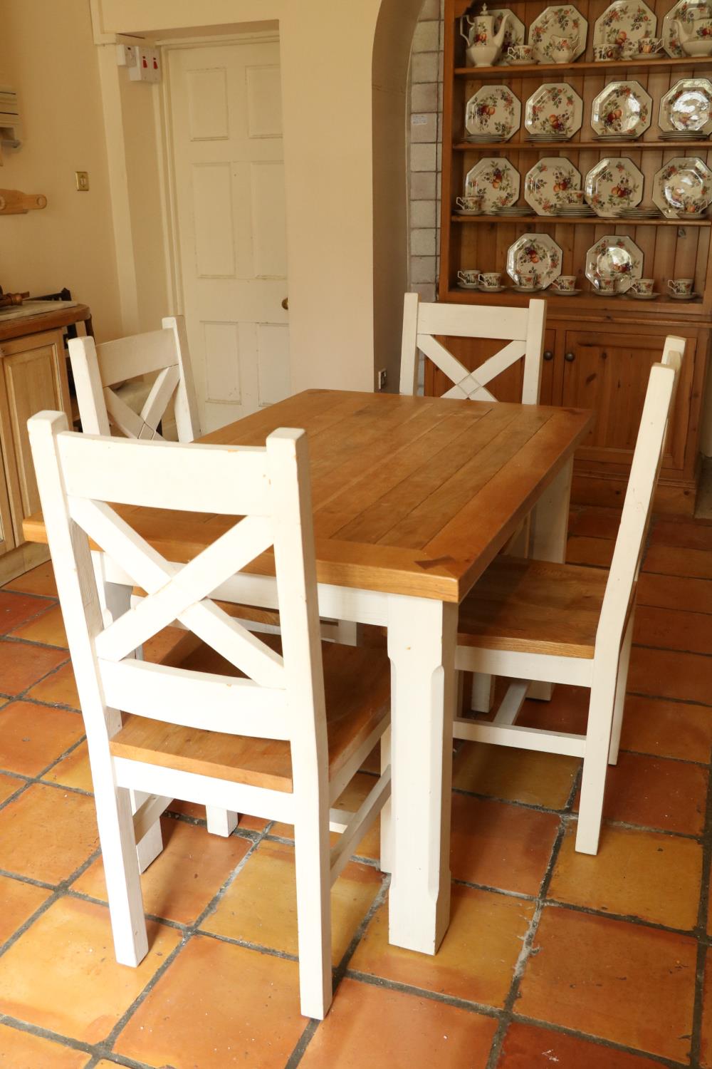 An oak and painted Kitchen Suite, comprising four heavy bracket type Chairs with X framed open