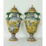 A very good tall pair of circular Majolica type Vases and Covers, decorated in mostly blue, yellow