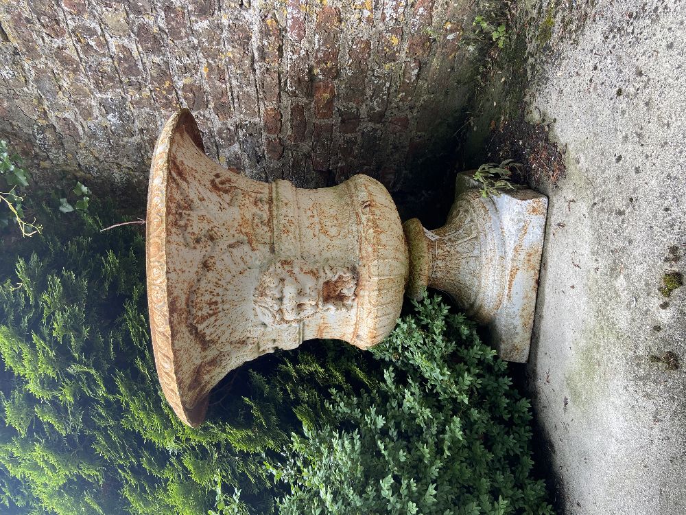 A very fine pair of heavy compana shaped cast iron Garden Urns, each with egg and dart folded rim