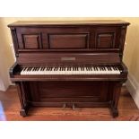 A good upright iron frame Piano, by W. Danemann & Co., London in mahogany case, 54 1/2'' (