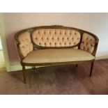 A French carved beech kidney shaped Settee, with triple panel back and ribbon moulded frame and