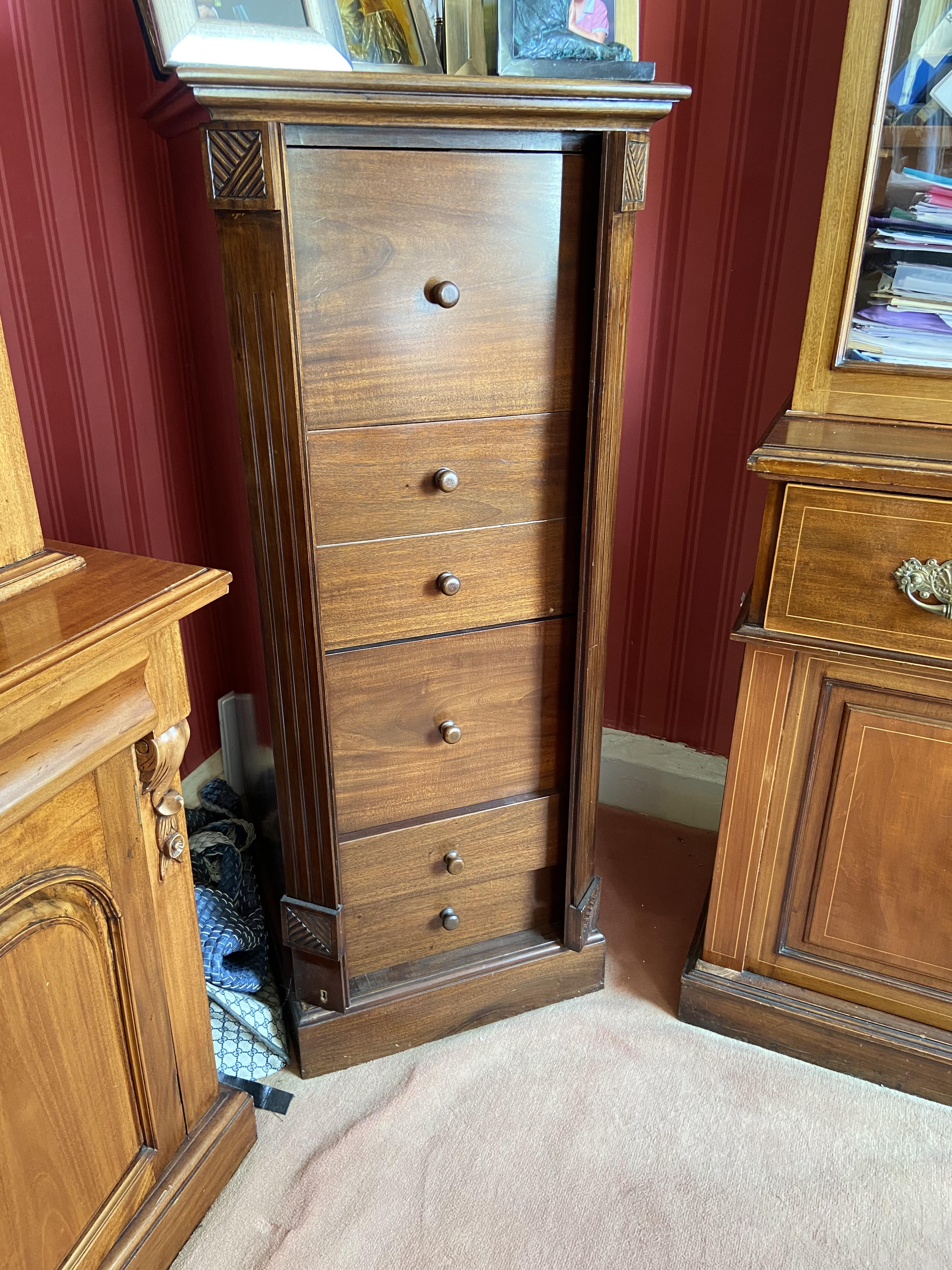 A modern mahogany Filing Cabinet, with moulded top above three filing drawers and two smaller