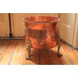 A brass mounted copper Planter or Fuel Bin, with lion paw feet, 14 1/2'' x 15'' (37cms x 38cms). (1)