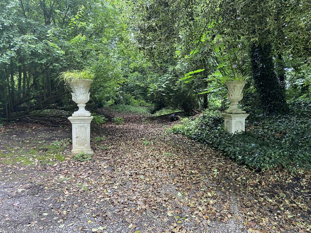 A pair of very attractive large Neo-Classical style composition Garden Urns, each with classical