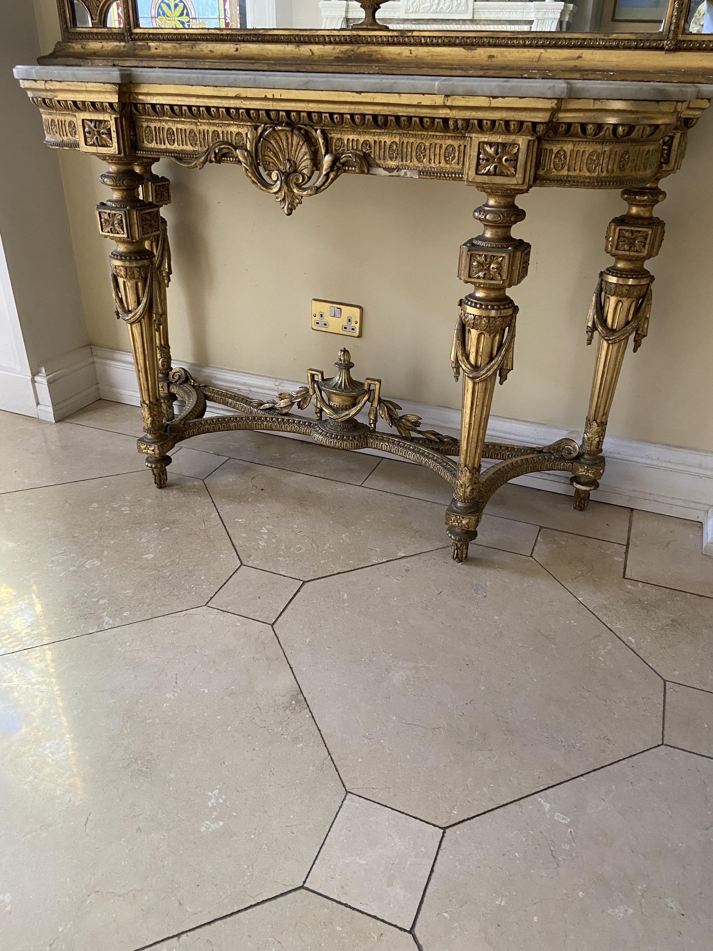 A 19th Century French gilt and gesso Console Table, with inverted breakfront white marble top, the