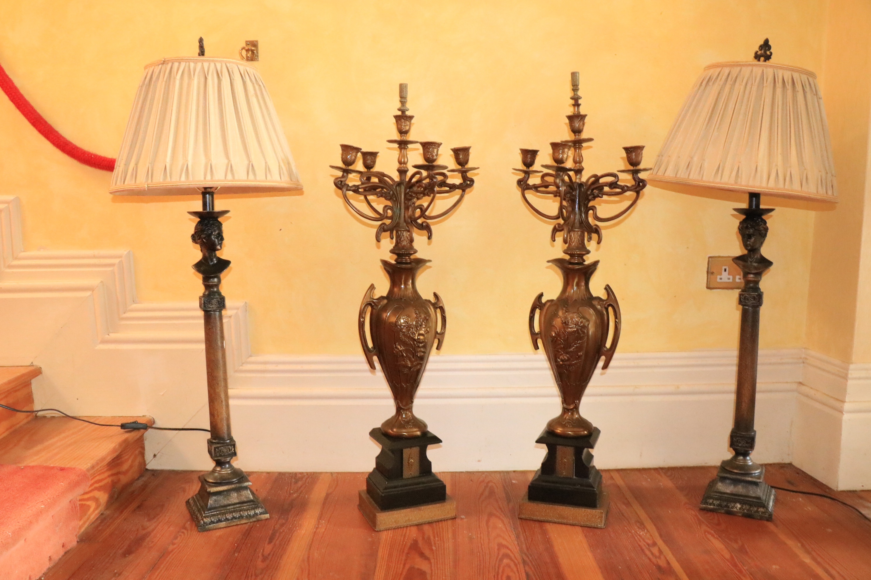 A pair of composition figural column Table Lamps, each surmounted with a female or male bust, with
