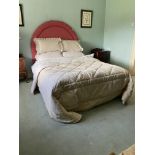 A modern 5' Bed Complete, with arched red padded headboard, quilted bedspread, duvet, linen and