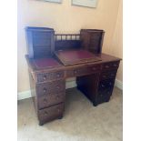 A Victorian mahogany pedestal Desk, the hinged slope top flanked to either side with a bank of