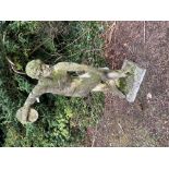A nicely weathered composition Figure, of naked disc thrower by a tree stump on rectangular base,