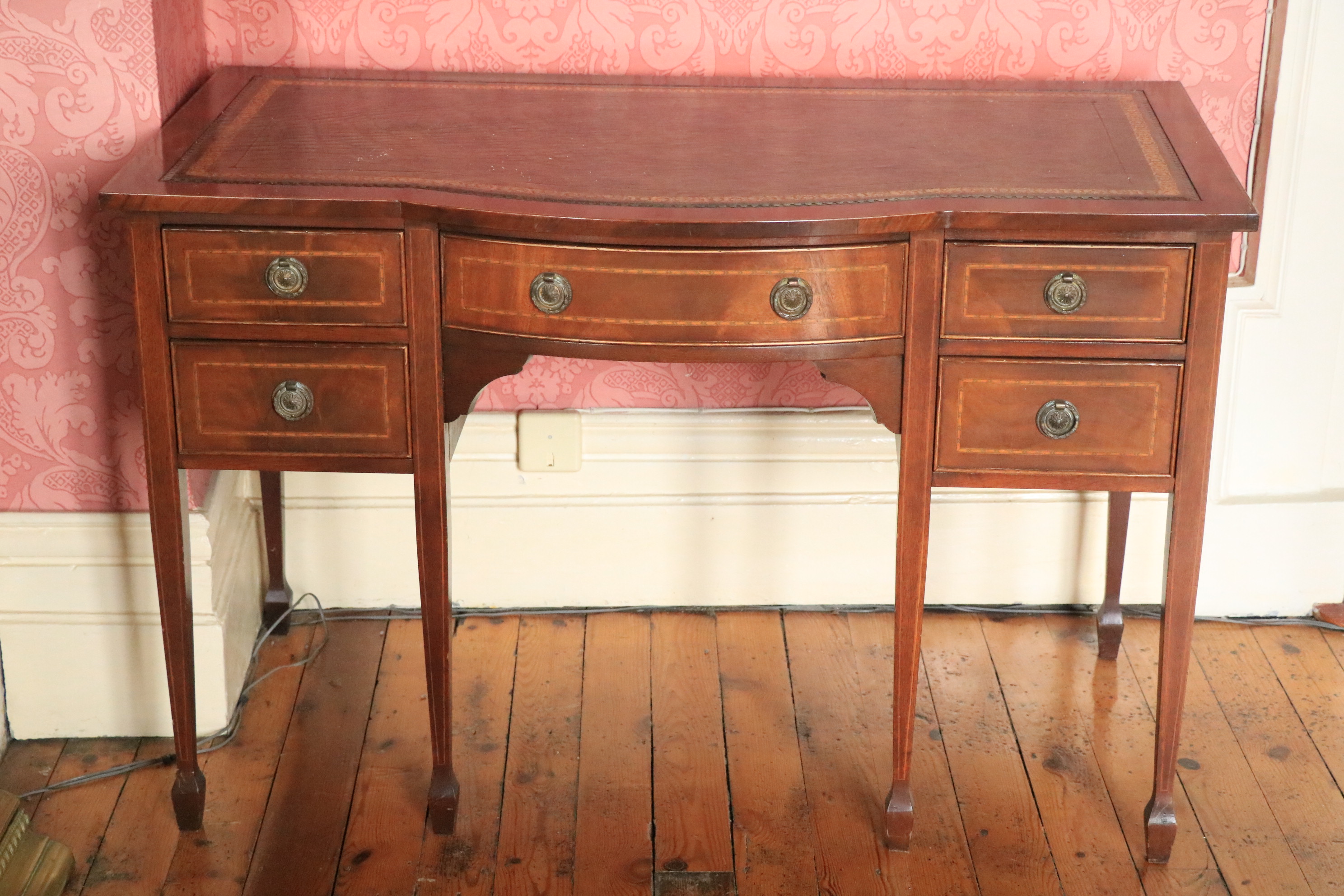 An attractive Edwardian bow fronted inlaid mahogany Ladies kneehole Writing Table, with green tooled