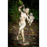 An attractive bronze Garden Group, modelled as a naked woman holding an infant in left arm and a