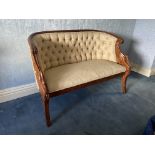 A Regency style carved mahogany Settee, with reeded top rail and button back, the moulded frame with