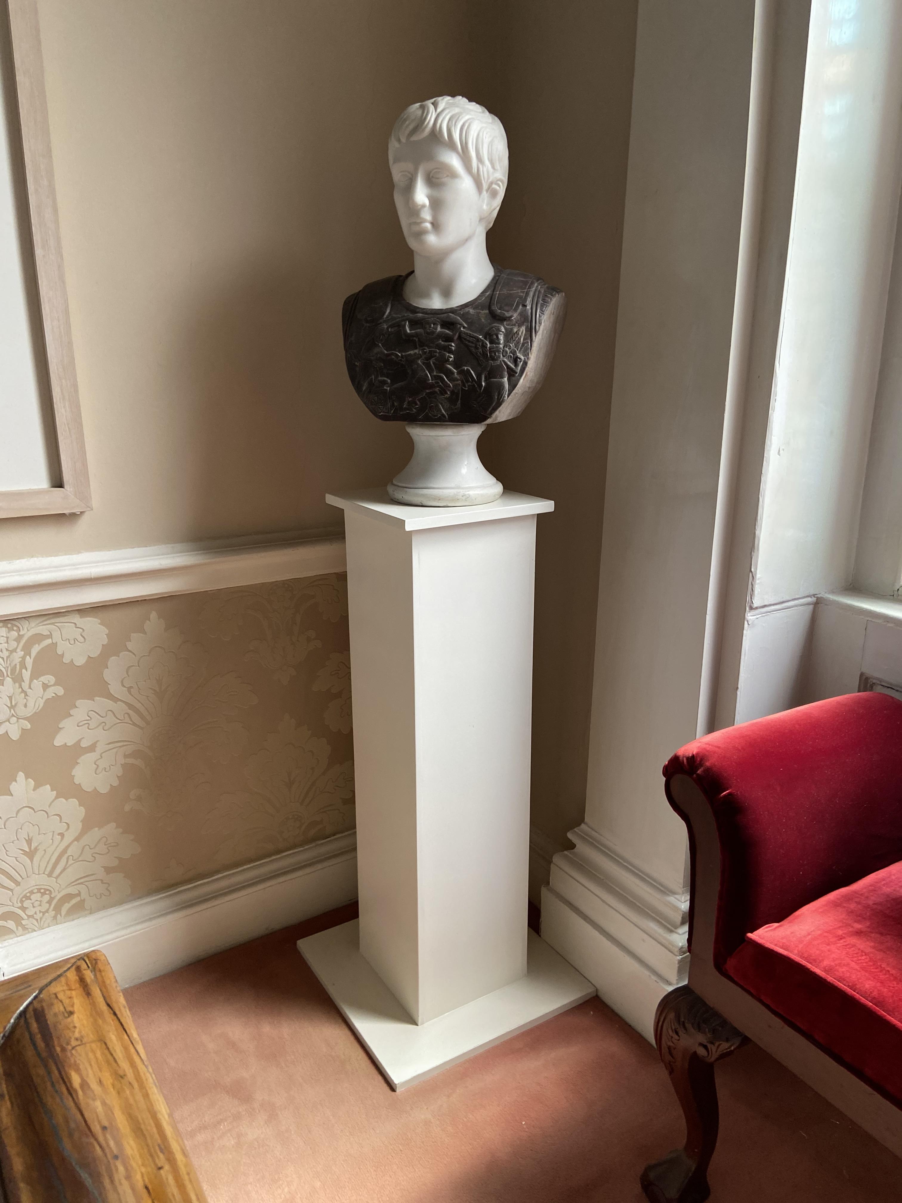 A two colour carved marble Bust, ''Caesar Augustus'' 25'' x 15'' (63cms x 38cms), on square