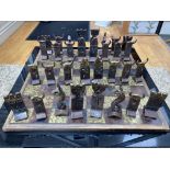 An attractive and unique hand made gilded iron Chess Set, modelled in the mythical Celtic style,