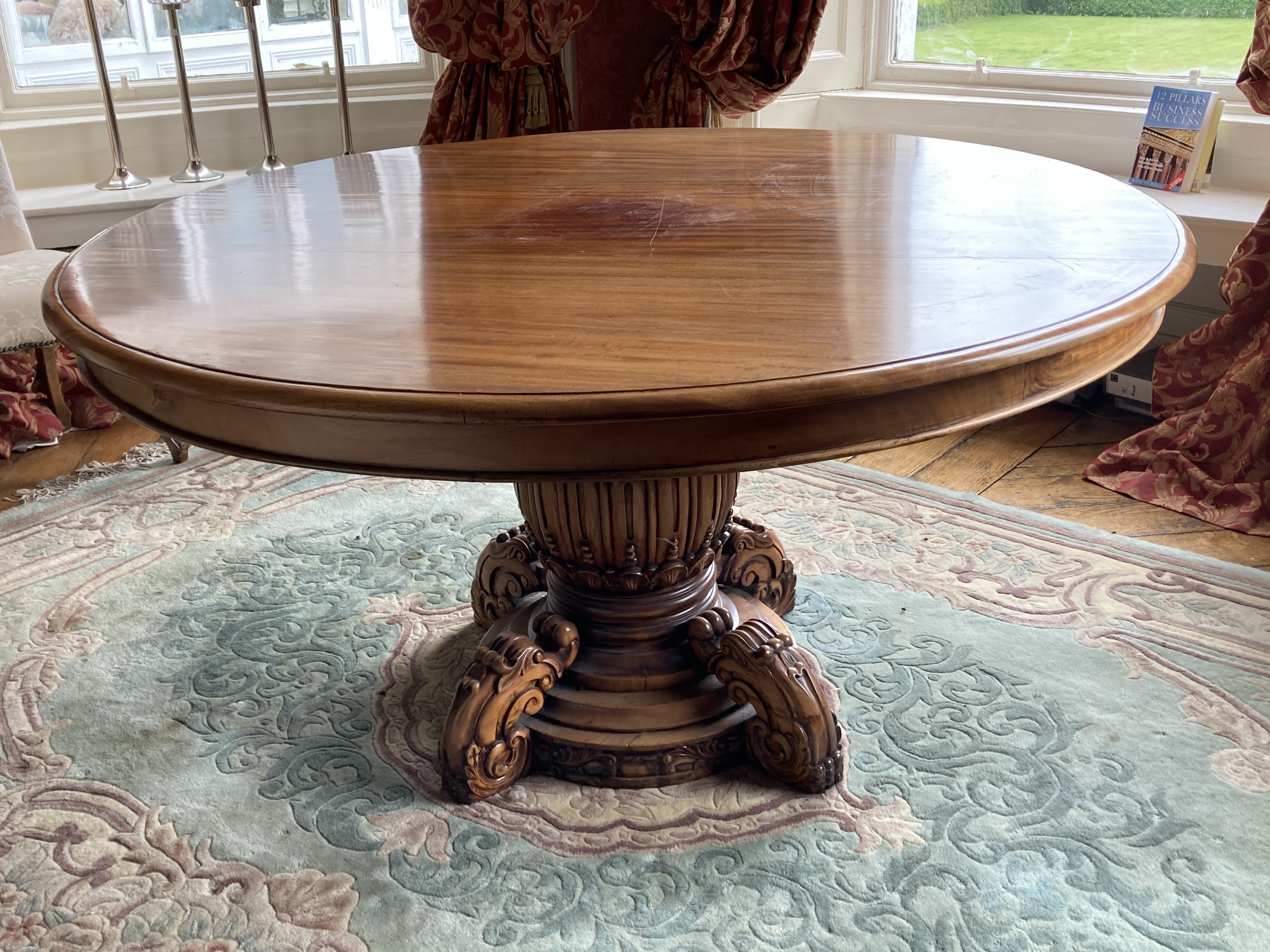 A large circular mahogany Breakfast Table, on reeded bulbous stem on a circular moulded base applied